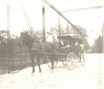 Irwin Plagge with buggy on the iron bridge over the Des Plaines River - abt. 1910